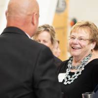 Chick Blue chatting with guests.